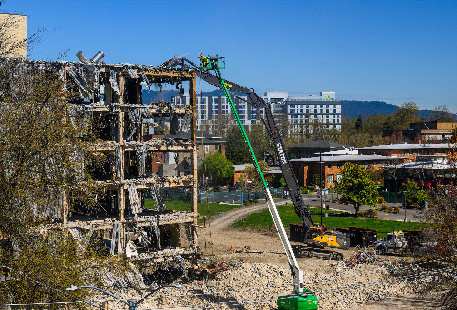 Staton high-reach excavator demolishing a concrete structure